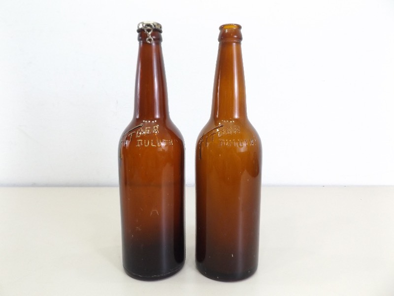 lot 143 image: 2 Vintage Fitgers Embossed Brown Beer Bottles