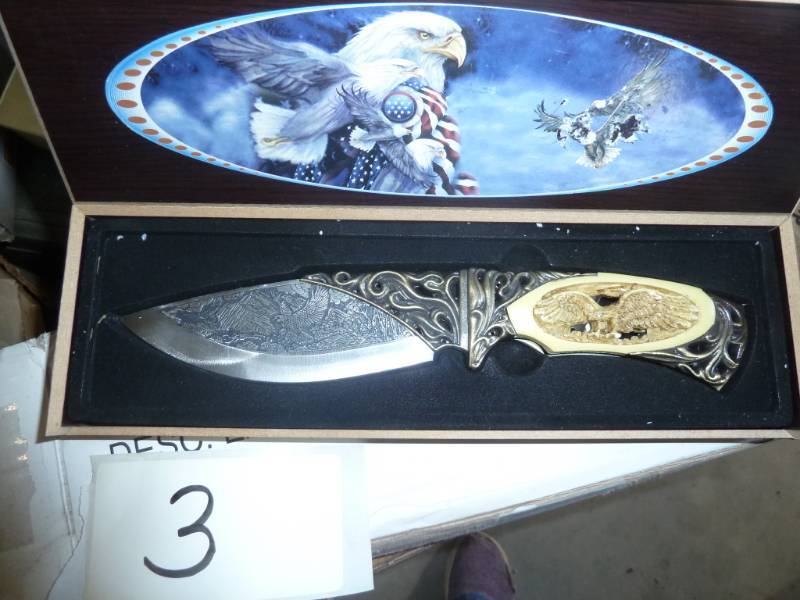 lot 3 image: New knife with eagle carved in the ...