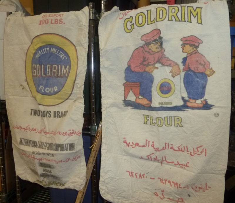 lot 8 image: 3 flour sacks, embroidered wall han...