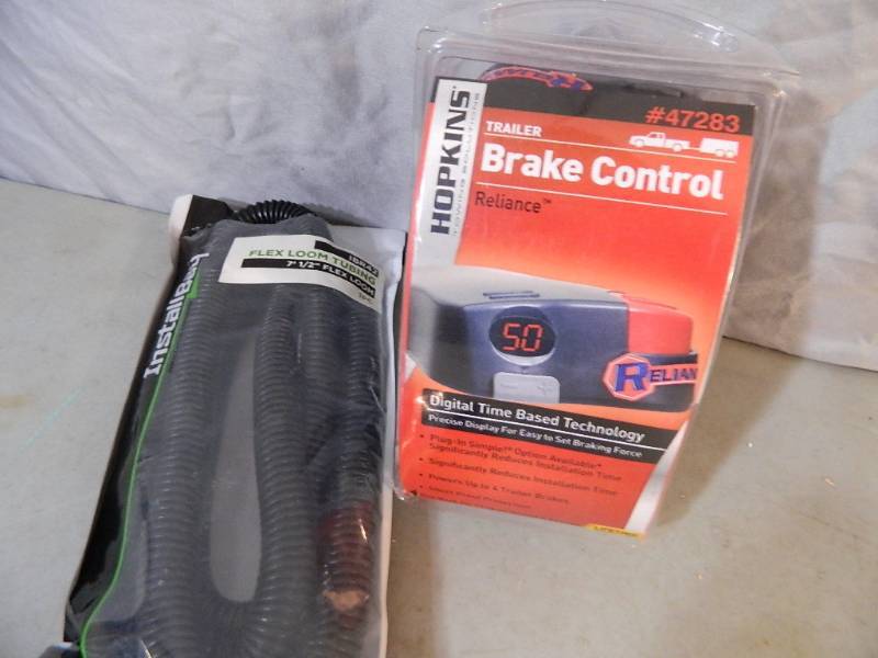 lot 97 image: New Trailer Brake Controller and Flex Loom Tubing