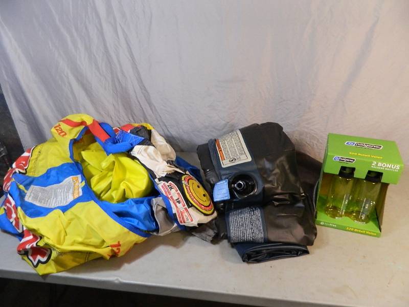 lot 146 image: Tube, New Water Bottles, and Air Matress