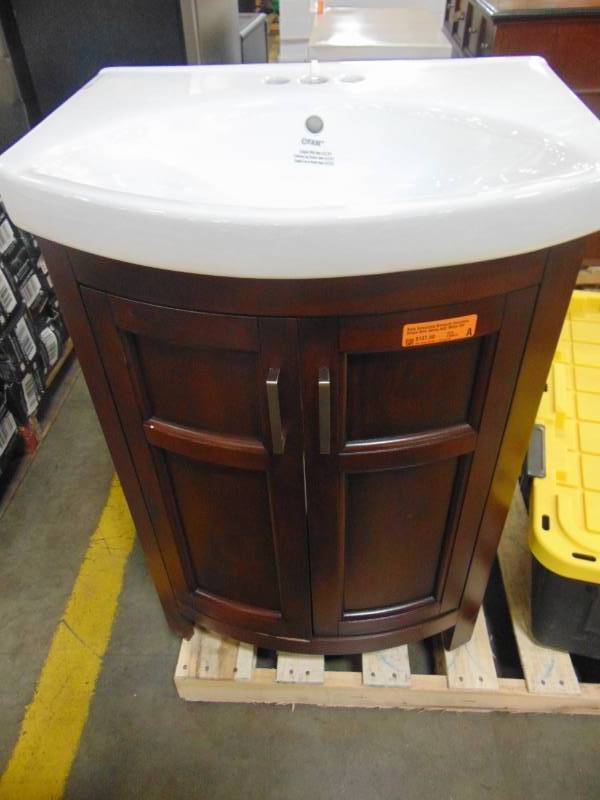 lot 29 image: Style Selections Morecott Chocolate Single Sink Vanity with White Vitreous China Top 1142VA-24-220
