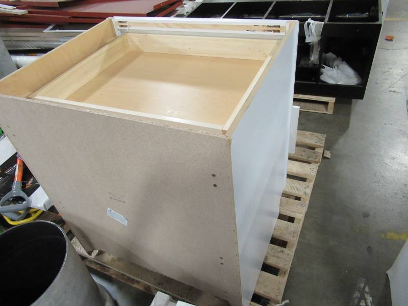 lot 239 image: Hampton Bay Shaker Assembled 30x34.5x24 in. Pots and Pans Drawer Base Kitchen Cabinet in Satin White, KDB30-SSW - Bottom Of Back Panel Cracked (Does not affect the Integrity)