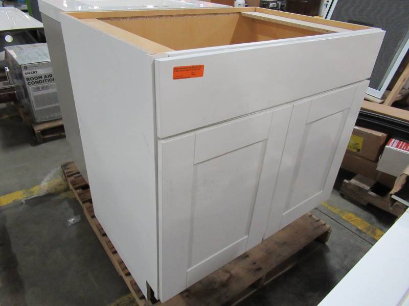 lot 248 image: Hampton Bay Shaker Assembled 36 x 24 x 34 12 Tall Sink Base Kitchen Cabinet in Satin White - Loose toe kick front.