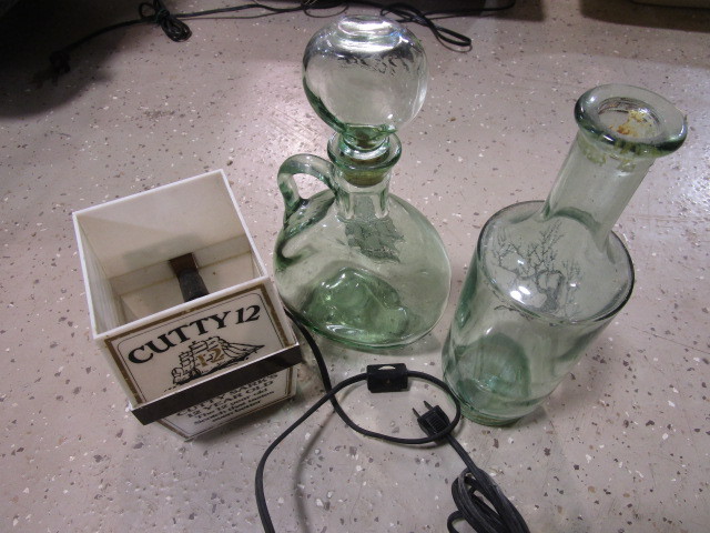 lot 365 image: CUTTY 12 LAMP AND BOTTLES