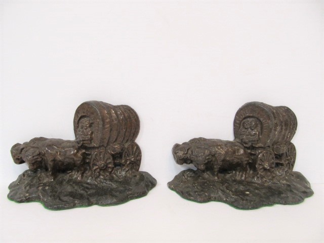 lot 109 image: Vintage 1930s Covered Wagon Gilt Cast Iron Bookends