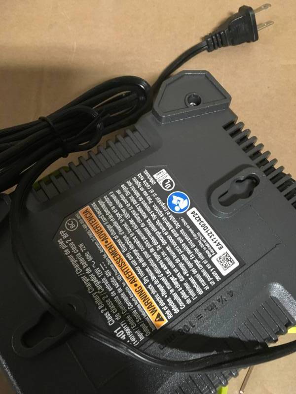 lot 58 image: Ryobi 40-Volt battery charger in good condition