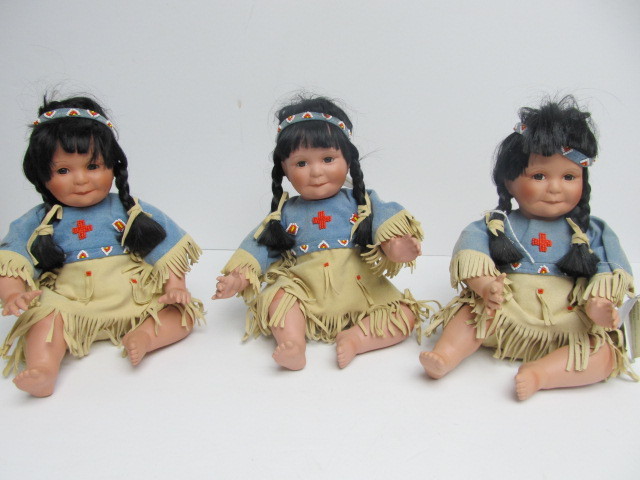 lot 9 image: Group of 3 Native American Porcelain Child Dolls From Danbury Mint - Song of The Sioux