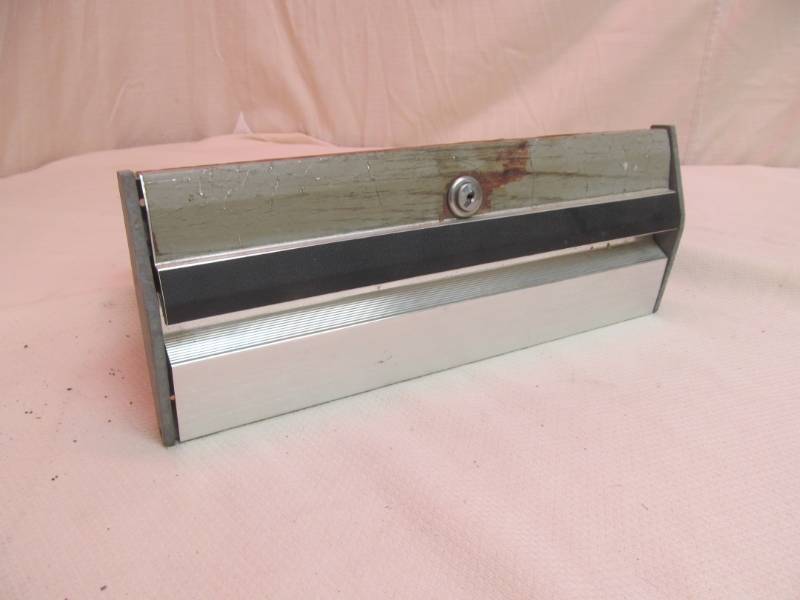 lot 32 image: vintage automotive glove box