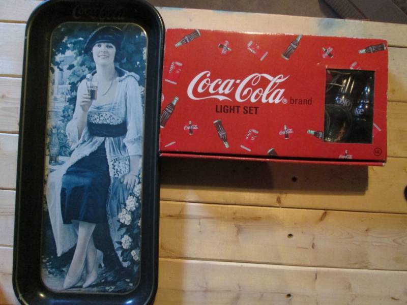 lot 27 image: Coca Cola lights and collector tin...