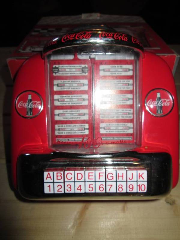 lot 28 image: Coca Cola collectible tabletop juke...