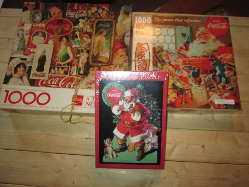 lot 32 image: 3 Coca Cola puzzles, 60 piece is un...