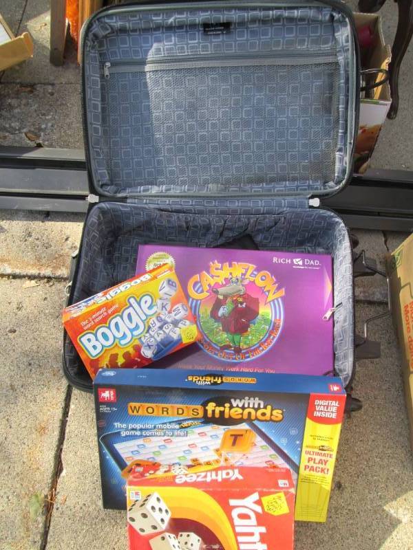 lot 92 image: Suitcase full of games and puzzles...