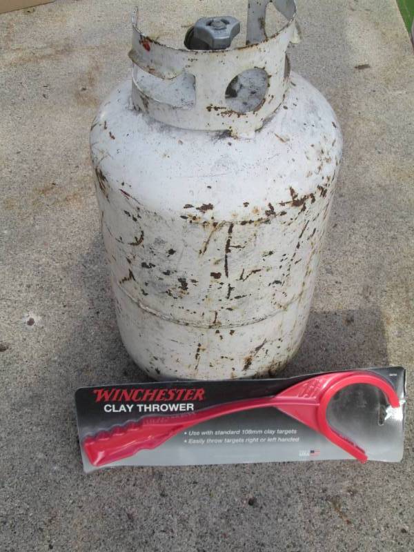 lot 123 image: Propane tank and clay pigeon throwe...