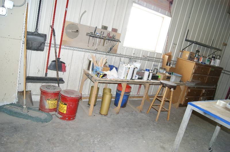 lot 018 image: Workbench and contents, Brooms, Flammable Rag Containers, Tools