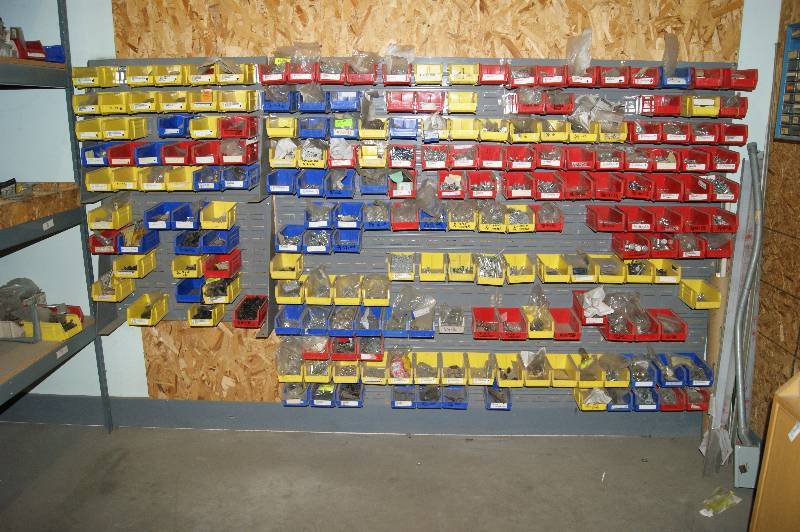 lot 038 image: Wall of Storage Trays and Contents