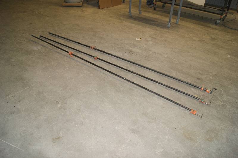 lot 107 image: Lot of (3) long pipe clamps