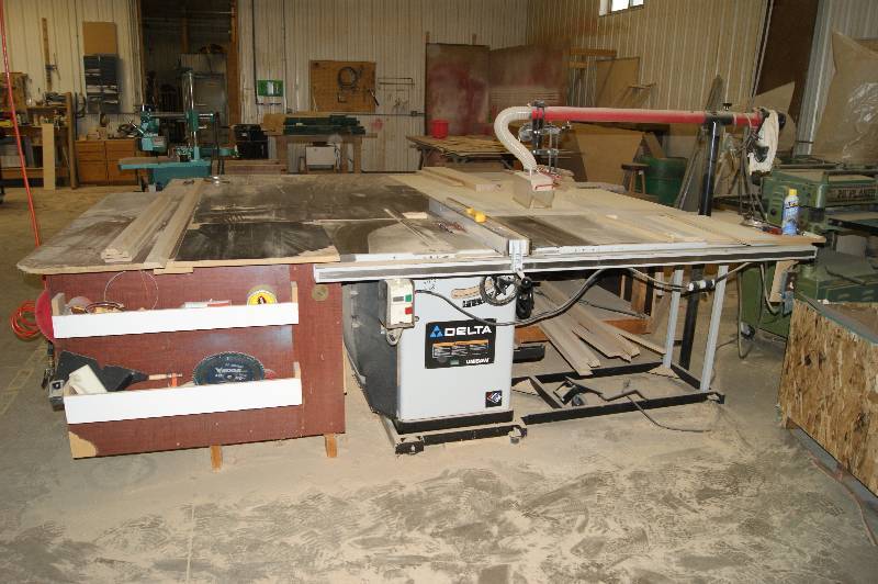 lot 124 image: Delta Table Saw, Table, and Contents