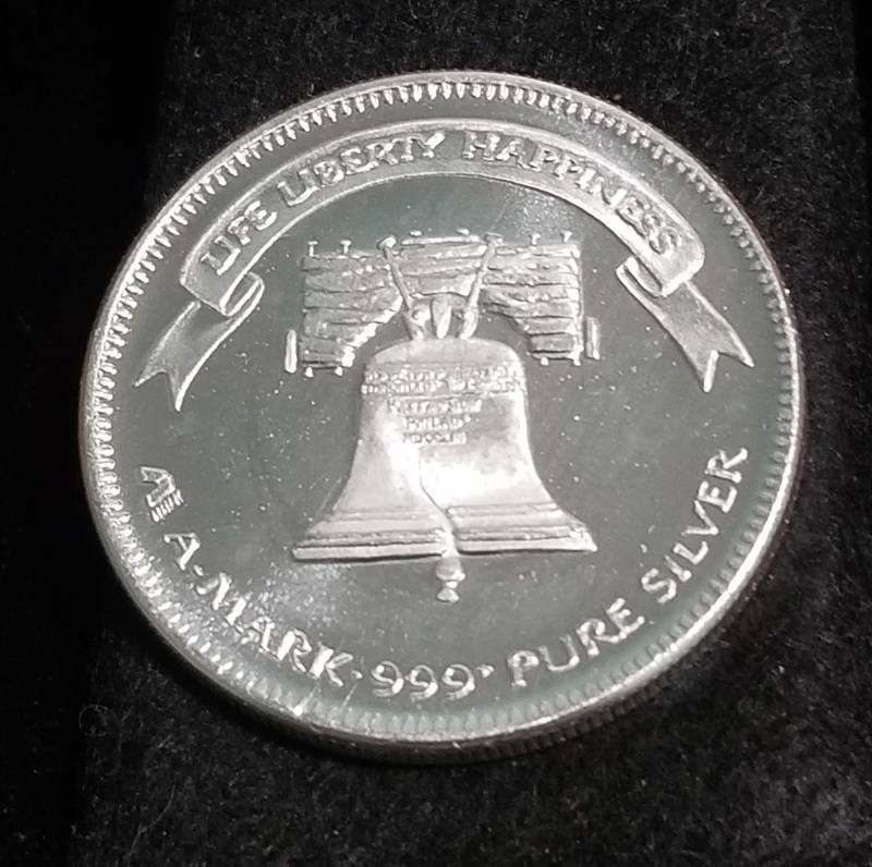 lot 55 image: 1 TROY OZ. .999 FINE SILVER 1984 A-MARK LIBERTY ROUND