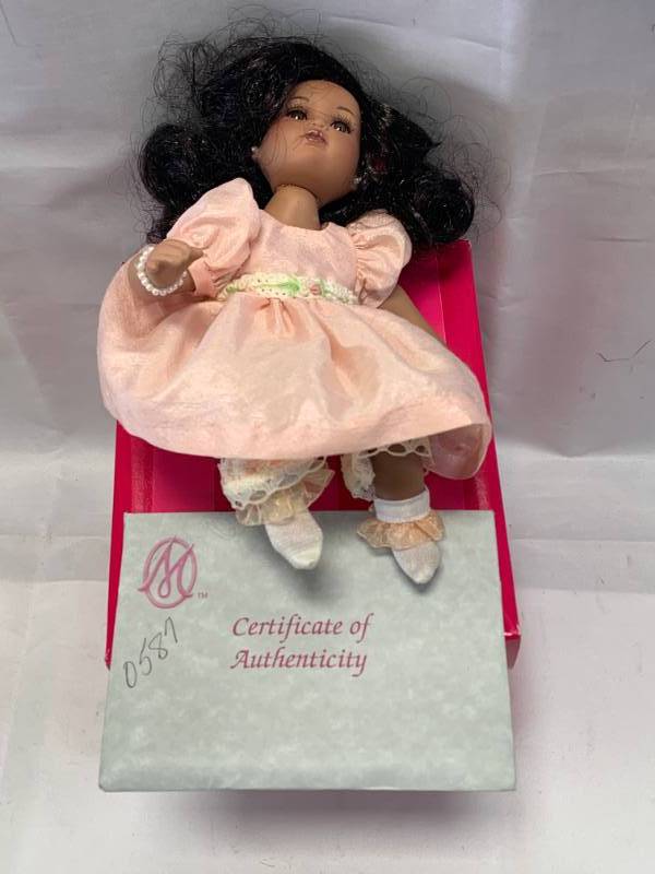 lot 13 image: Marie Osmond Rose Bud Porcelain Doll $68 Retail