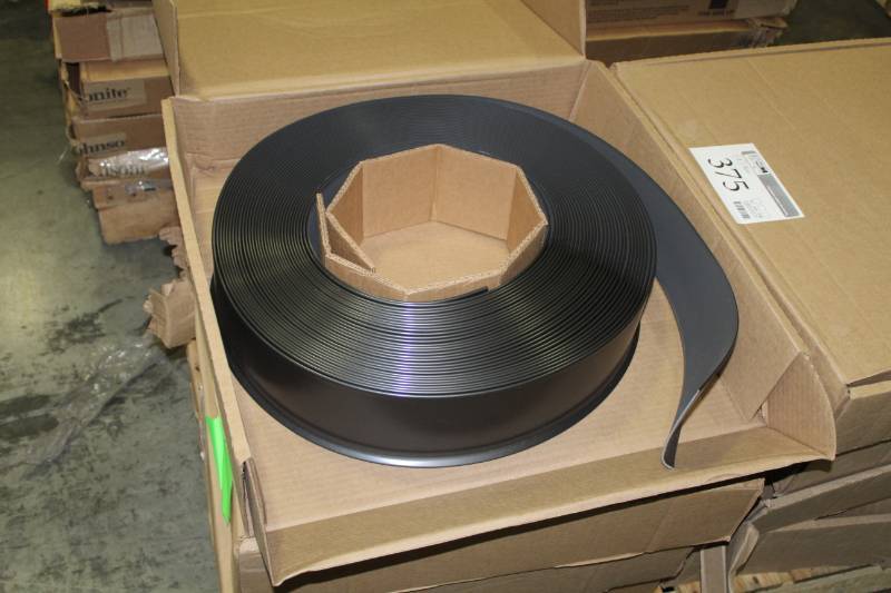 lot 374 image: Lot of (4) Boxes of 4x18in. Rubber Cove Base Coil 120ft.
