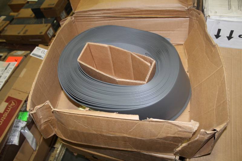 lot 378 image: Lot of (5) Boxes of VPI Wallbase 18x6in. Vinyl Toe Molding Coil CharcoalBlack Brown 96LF