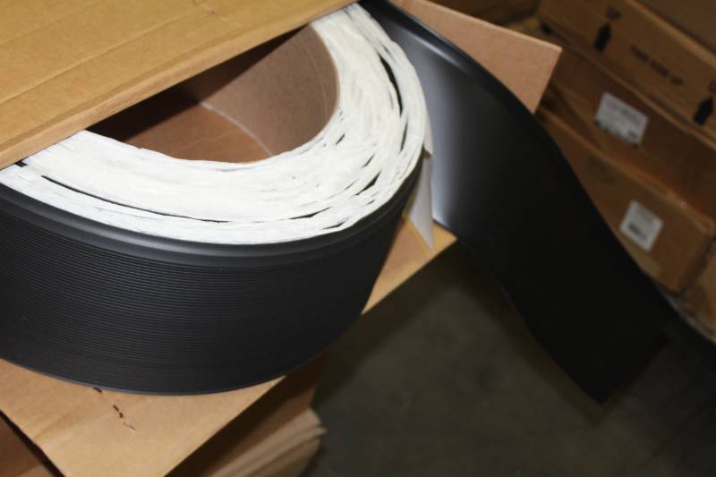 lot 397 image: Lot of (6) Boxes of Johnsonite ColorMatch CB-55 4x120in. Vinyl Toe Molding Silver Grey, CB-40 6x100in. 18in. Vinyl Toe Molding Black