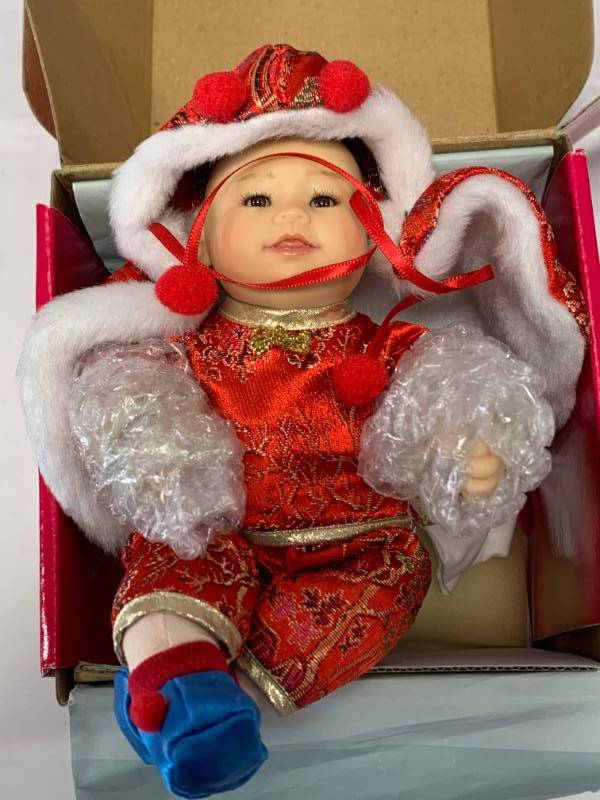 lot 24 image: Marie Osmond Shao Pang Tiny Tot Porcelain 7 Doll $49.50