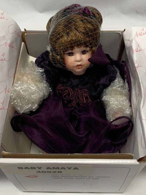 lot 63 image: Marie Osmond Baby Amaya Porcelain 7 Doll $48 Retail