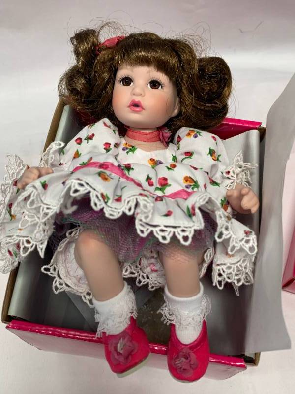 lot 85 image: Marie Osmond Amayas Springtime Porcelain 7 Doll $43.25 Retail