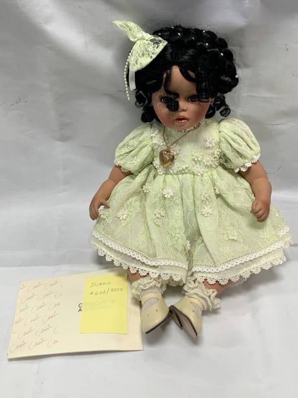 lot 94 image: Green Flowered Dress 10 Porcelain Doll (no box)