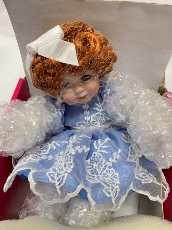 lot 67 image: Marie Osmond Lilly Porcelain 7 Doll $49 Retail