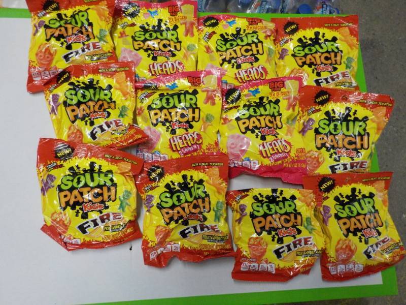 lot 75 image: 12 bags Sour Patch Fire and Heads...