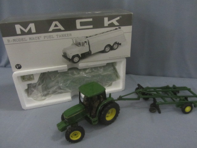 lot 28 image: Mack R Model Fuel Truck, JD Tractor