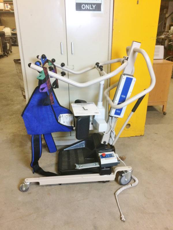 lot 40 image: MSRP $5100 Invacare Reliant Plus 350 Stand-Up Electric Patient Lift With Sling, Battery, Charger & Operation Manual - Excellent Working Condition SEE YOUTUBE