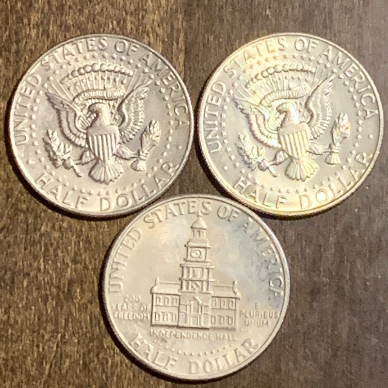lot 47 image: (3) Kennedy Half Dollars