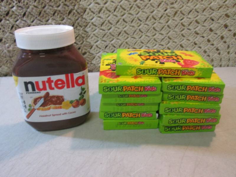 lot 57 image: Jar of Nutella and 11 Boxes of Sour...