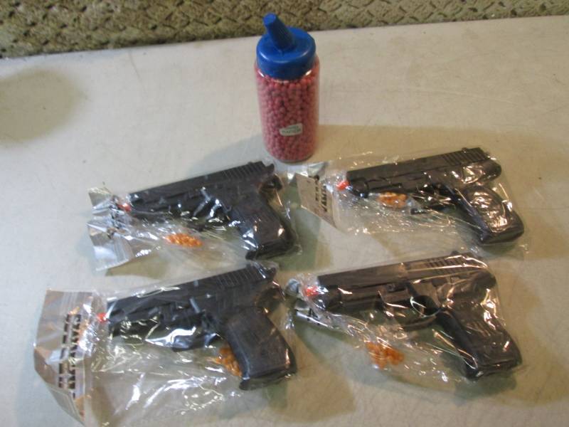lot 89 image: 4 Airsoft Pistols with Bottle of 20...