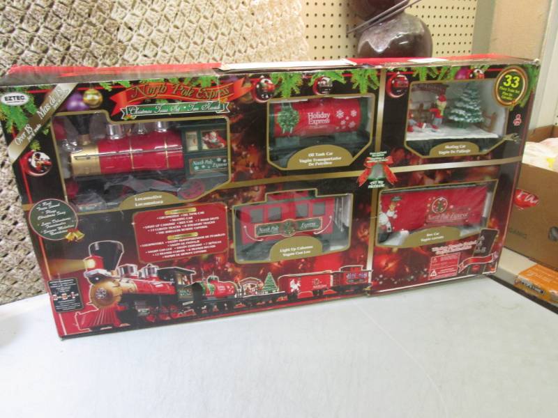 lot 221 image: North Pole Express 33pc Christmas T...