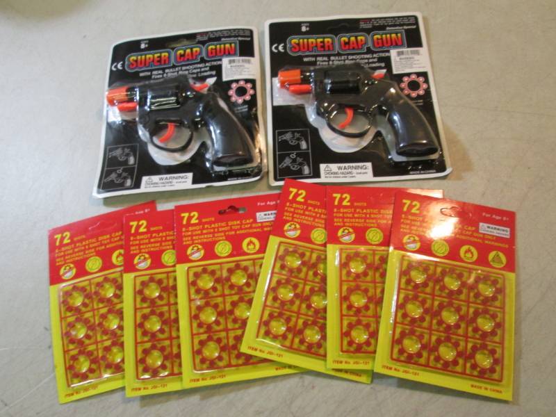 lot 232 image: Lot of 2 Super Cap Guns and 6 Packs...