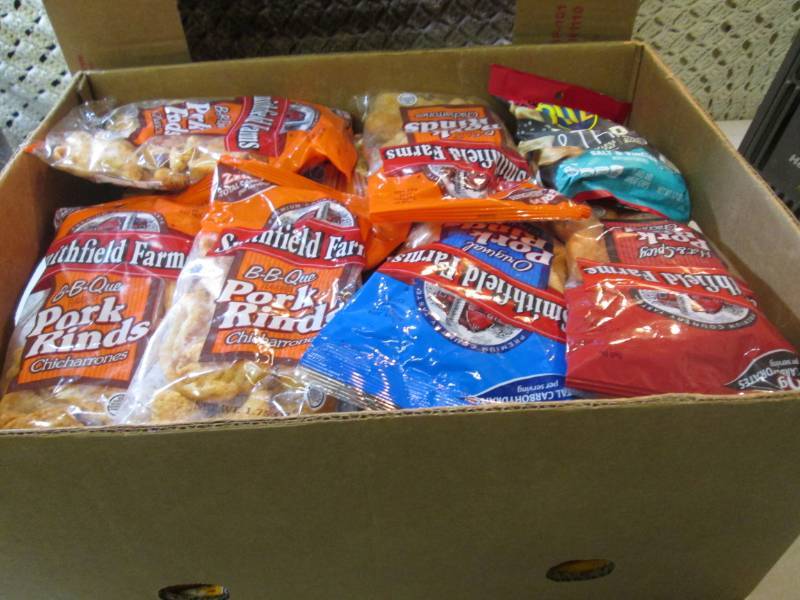 lot 264 image: Box Full of Assorted Chips and Pork...