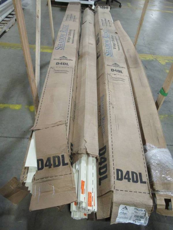 lot 230 image: Pallet of Georgia-Pacific Double Lap Siding and Corner Posts In Cream. Approximately 12 Pieces.