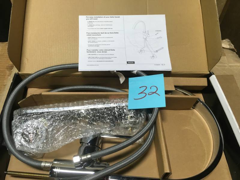 lot 32 image: Delta Mandolin Single-Handle Standard Kitchen Faucet in Chrome- good condition