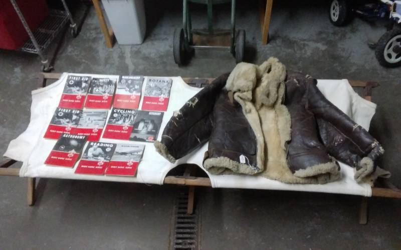 lot 7 image: Vintage Army Cot, Parachuters Jacket (Rough) & 11 Boy Scout Books