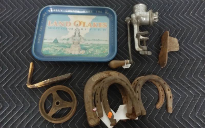 lot 12 image: Land O Lakes Metal Tray, Old Grinder, Shoe Last, Vintage Horse Shoes