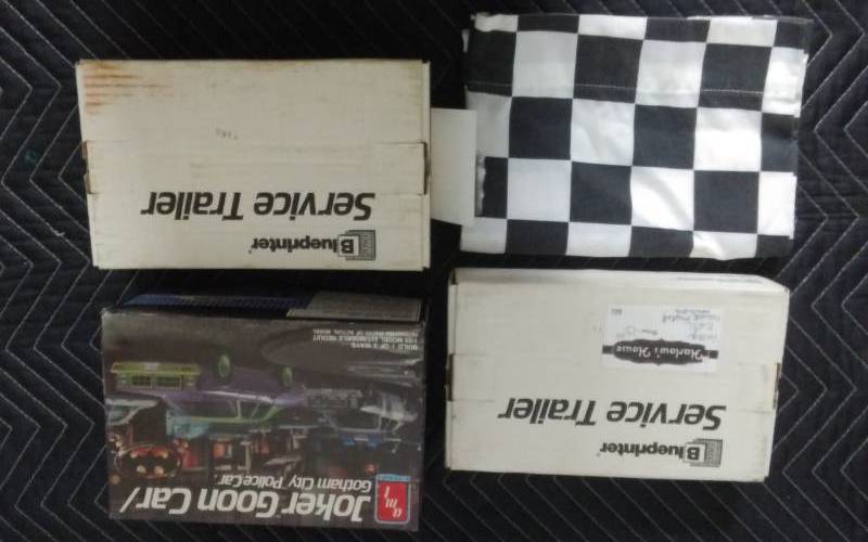 lot 29 image: Joker Goon Car Model, 2-Vintage Ertl Trailer Models, Checkered Flag Pillow Case