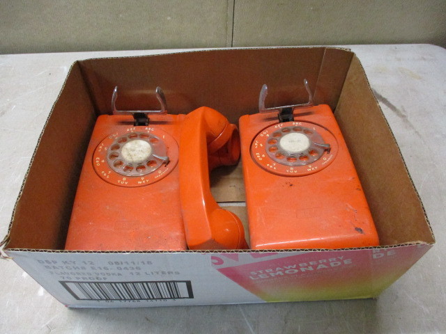 lot 30 image: Antique Orange Phones