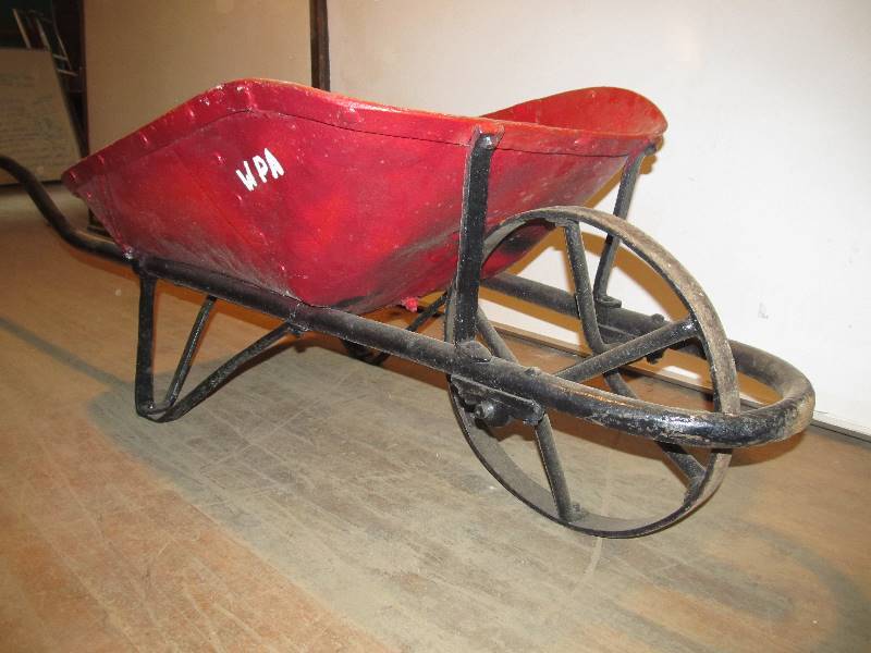 lot 86 image: Antique Mining Company Wheelbarrow