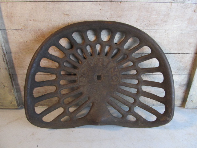 lot 33 image: Antique McCormick DEERING International Harvester Embossed Iron Tractor Seat