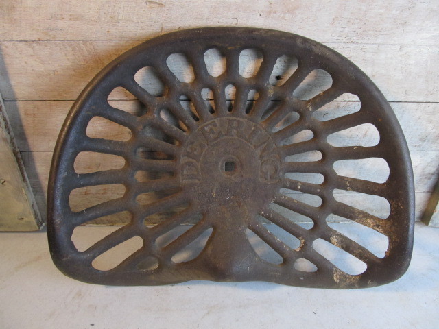 lot 35 image: Antique McCormick DEERING International Harvester Embossed Iron Tractor Seat
